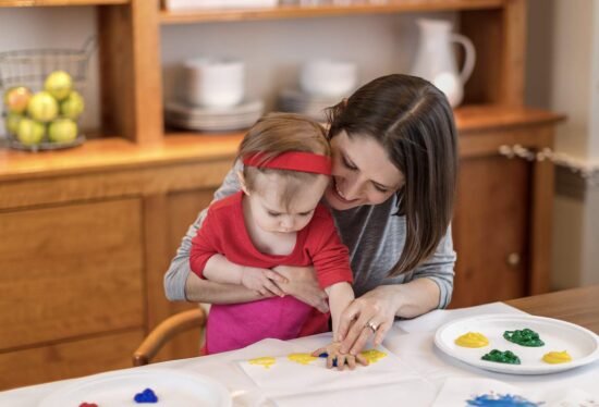 Mother and baby finger painting