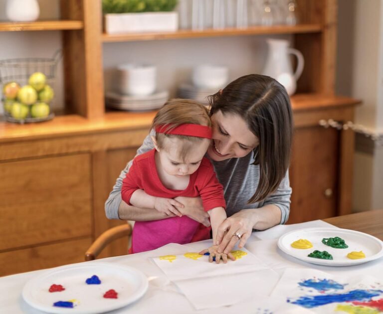 Mother and baby finger painting