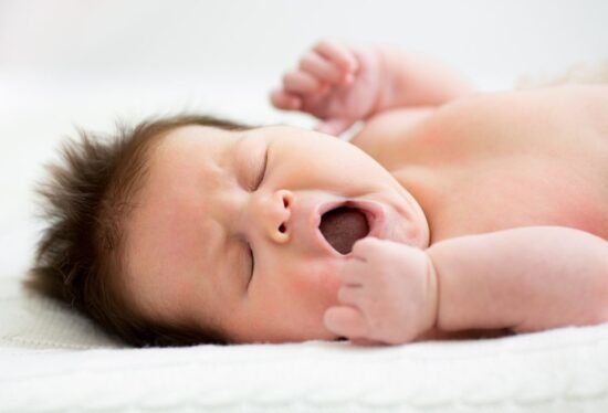 New born baby yawning