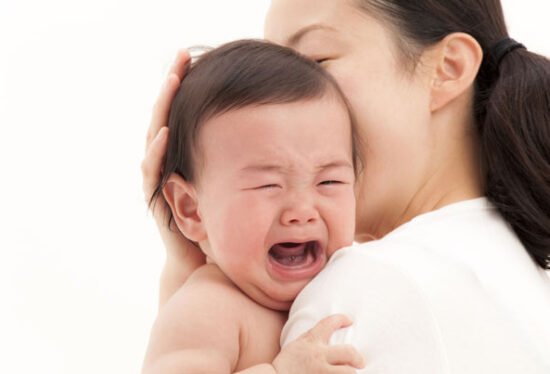 Mother Soothing a crying baby
